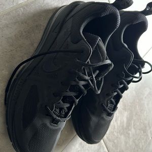 A fairly used Nike genome in all black color, US size 11.